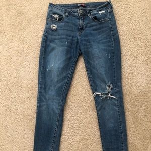 Distressed dark wash jeans